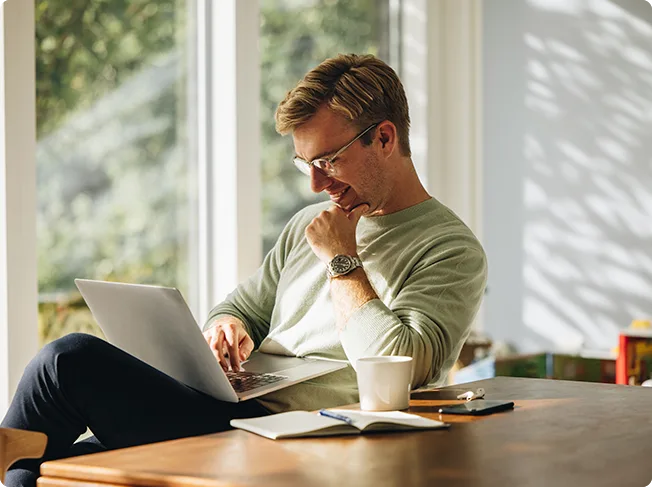 Man working on a laptop at home